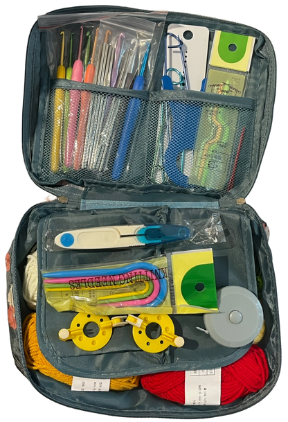 Open crochet knitting kit with various tools and materials on a white background