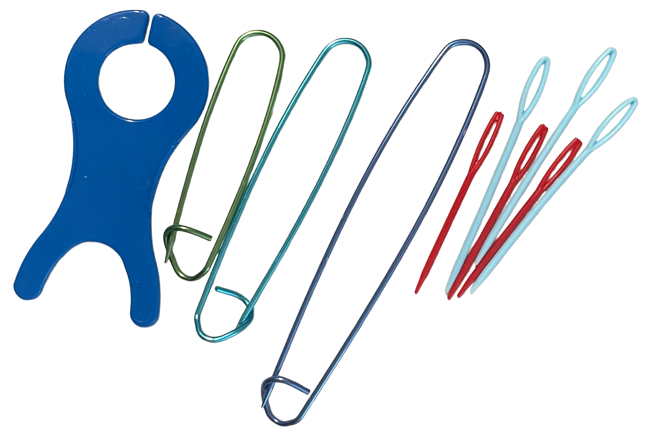 Set of colorful sewing needles and a blue plastic tool on a white background