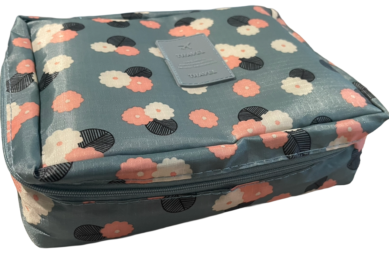 Floral patterned crochet kit bag on a white background