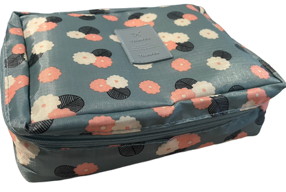 Floral patterned crochet kit bag on a white background