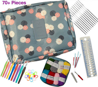 Crochet kit with floral-patterned pouch, yarn, hooks, and tools on a white background