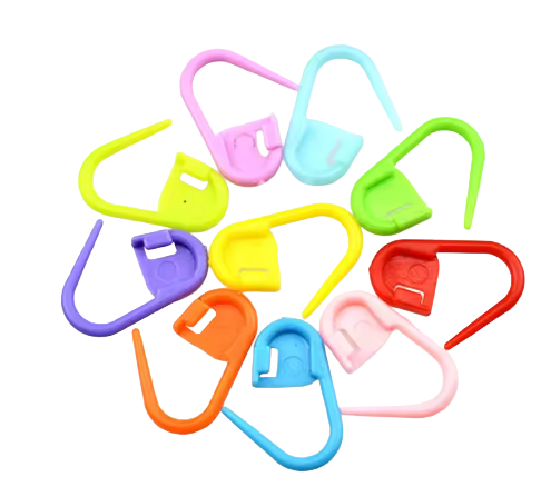 Colorful plastic stitch holders markers for crochet hooks on a white background
